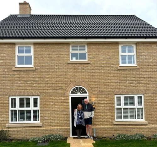 Bianca and Joe, pictured in front of their new home at Mill View in Norfolk from Orbit Homes.
